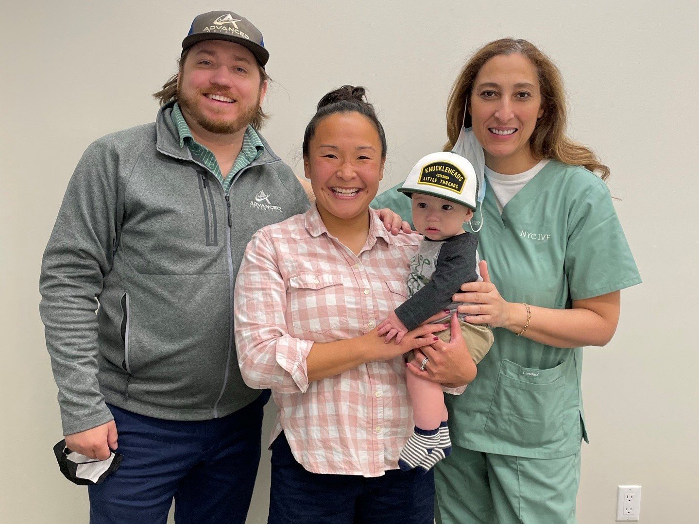 Dr. Alyaa Elassar with a patient family and their baby